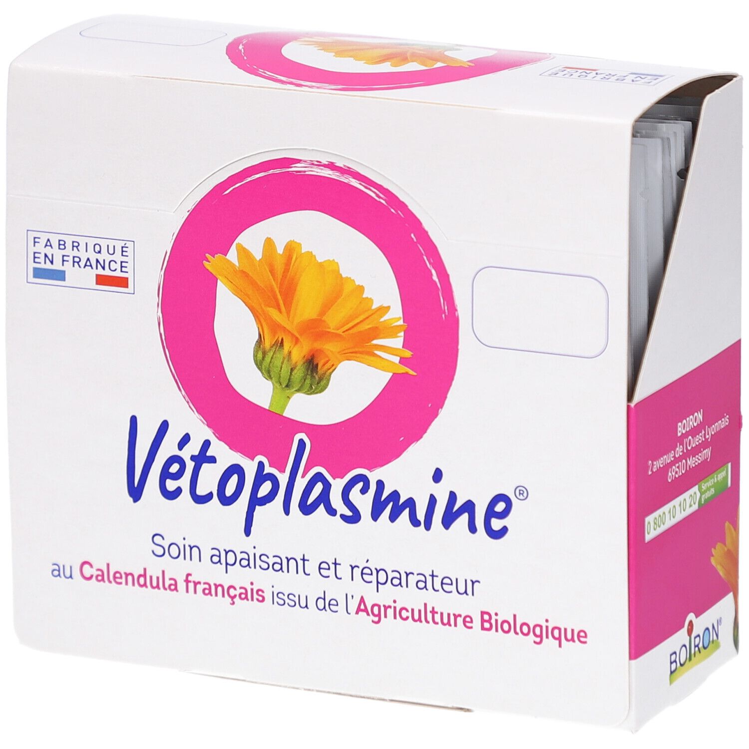 Weißer Karton mit rosa Akzenten. Aufdruck: Vétoplasmine, Ring mit Blüte, Text. Hergestellt in Frankreich. BOIRON-Logo.