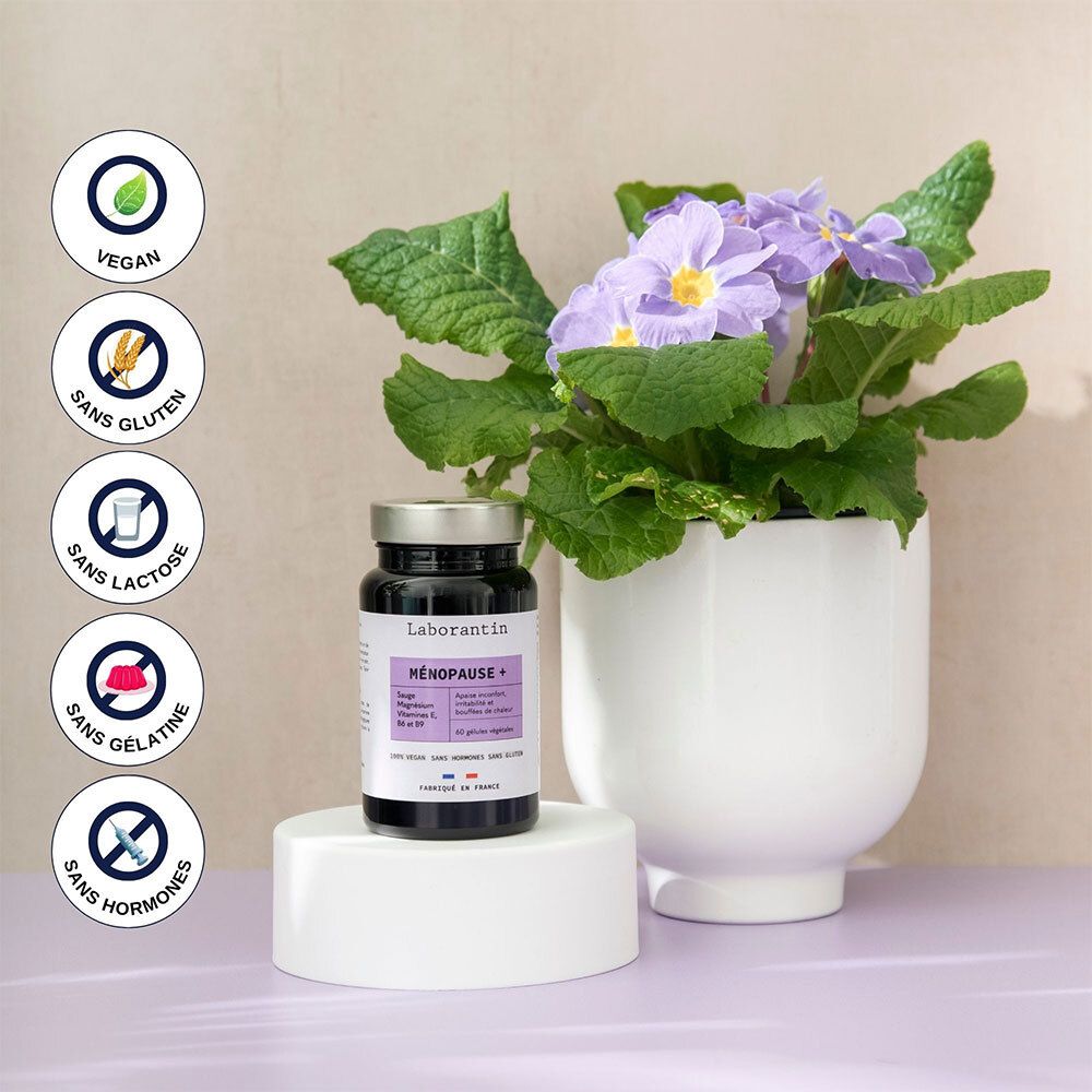 Flasche neben Topf mit lila Blumen. Vegan, glutenfrei, laktosefrei, ohne Gelatine, ohne Hormone.