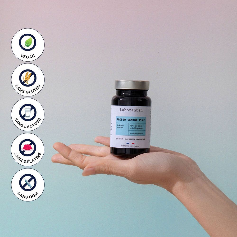 Main tenant un flacon. Symboles: Vegan, Sans gluten, Sans lactose, Sans gélatine, Sans OGM.