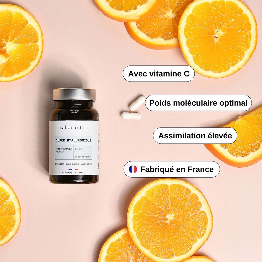 Flasche mit Kapseln und Orangen. Text: Avec vitamine C, Poids moléculaire optimal, Assimilation élevée, Fabriqué en France.