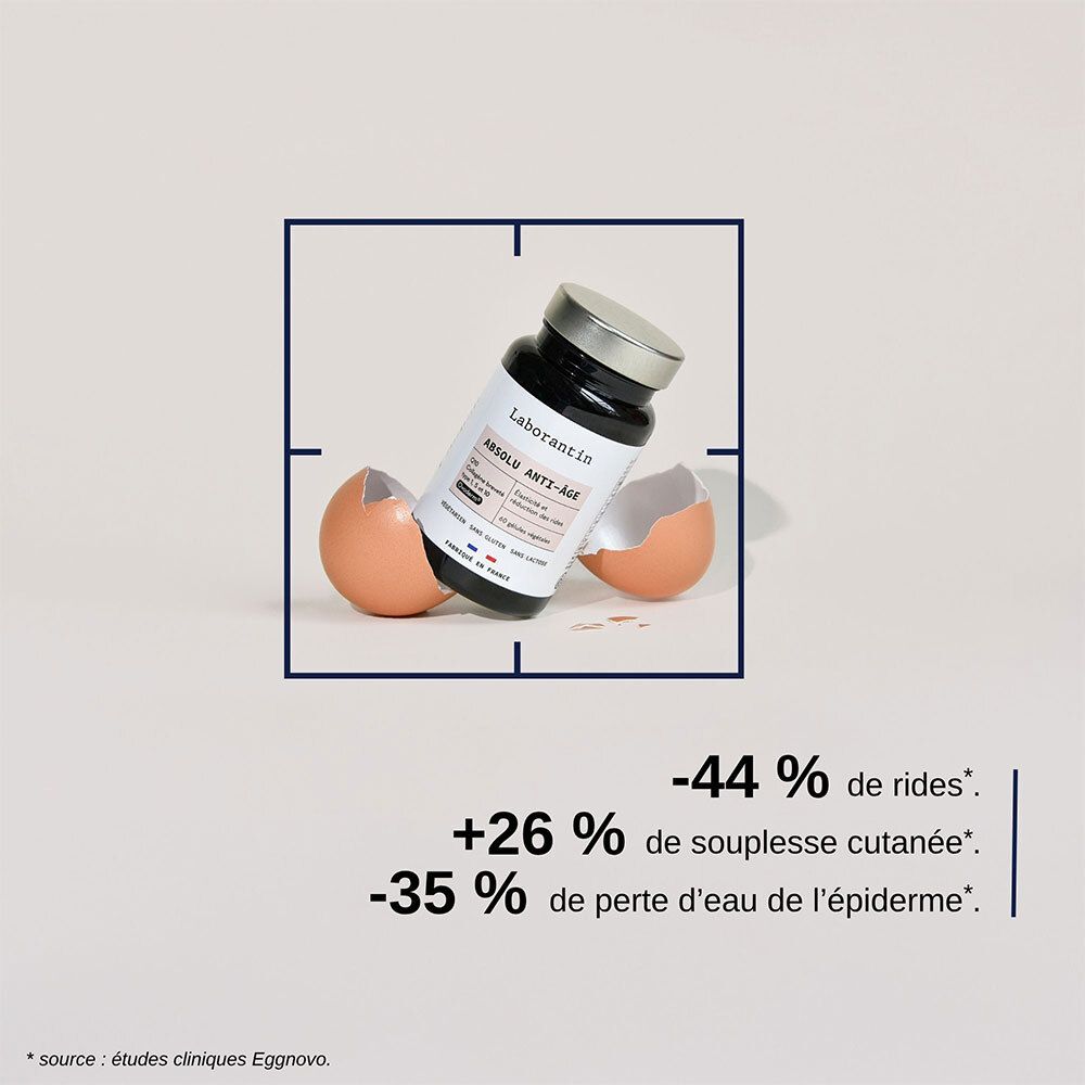 Flacon Laborantin Absolu Anti-Âge, entouré de coquilles d'œufs cassées. Texte : -44 % rides, +26 % élasticité, -35 % perte d'eau.