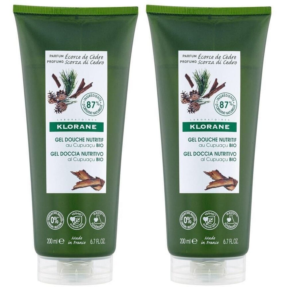 Deux tubes de gel douche verts. Inscription: KLORANE, Gel Douche Nutritif. Illustration de plantes et bois. 200 ml.