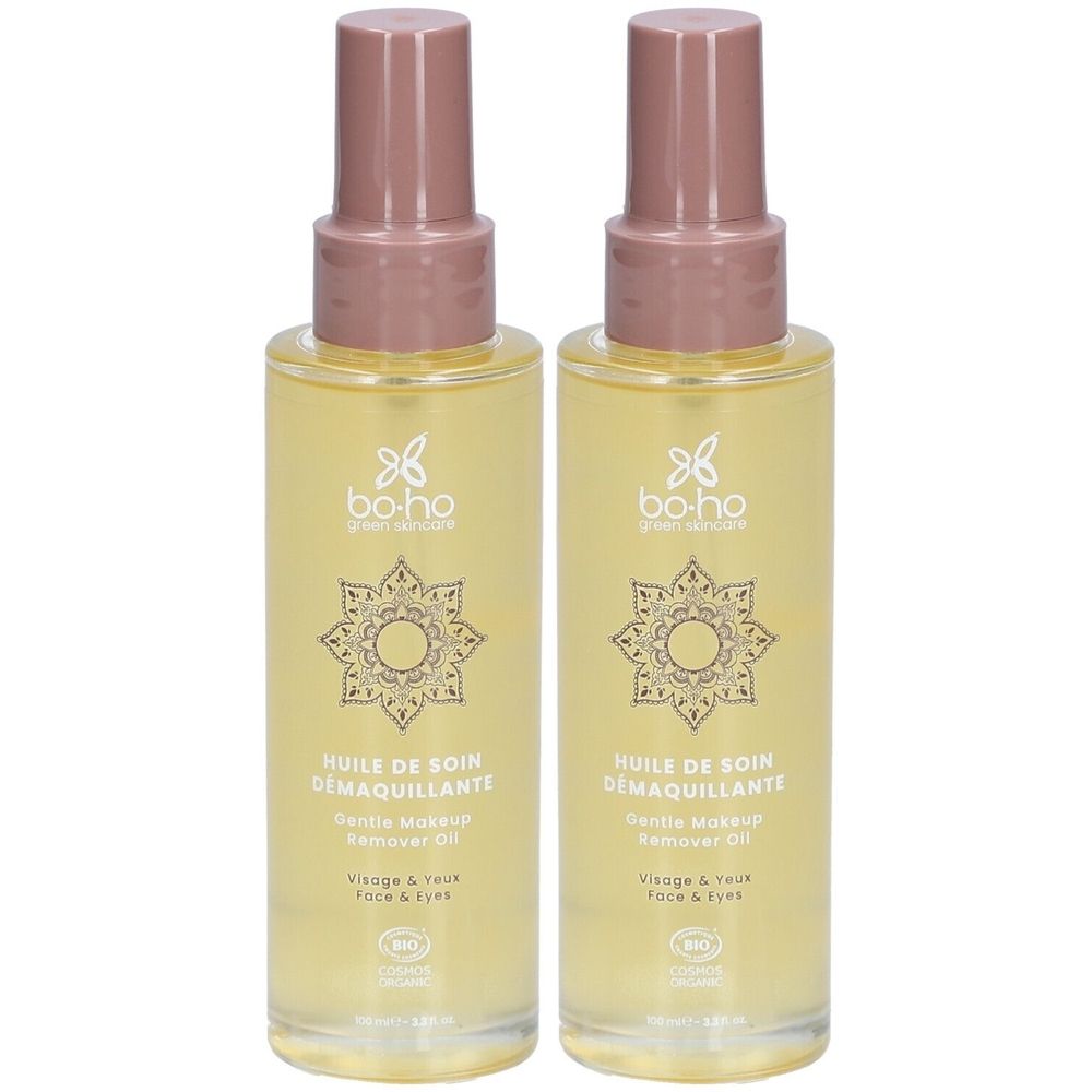 Zwei Flaschen BOHO Pflegeöl zum Abschminken mit Pumpspender. Gelbes Öl in durchsichtigen Flaschen mit rosa Verschluss.