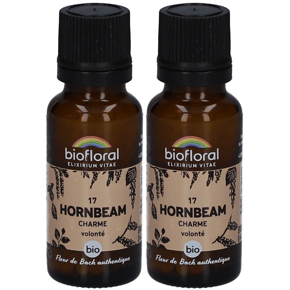 Deux flacons en verre brun avec des bouchons noirs. Étiquettes avec "biofloral", "HORNBEAM", "CHARME", "volonté" et "bio".