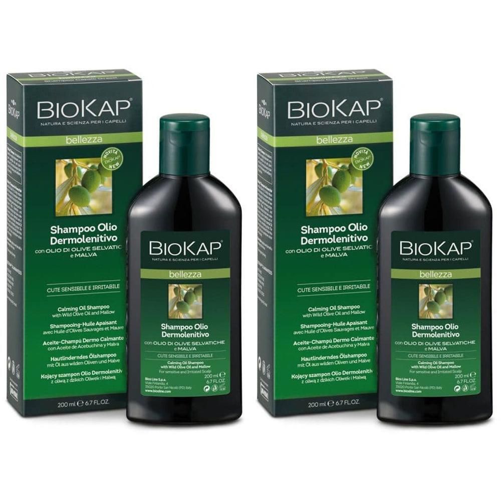 Deux bouteilles et deux boîtes de shampooing. Inscription : BIOKAP, Shampoo Olio Dermolenitivo. Vert et noir.