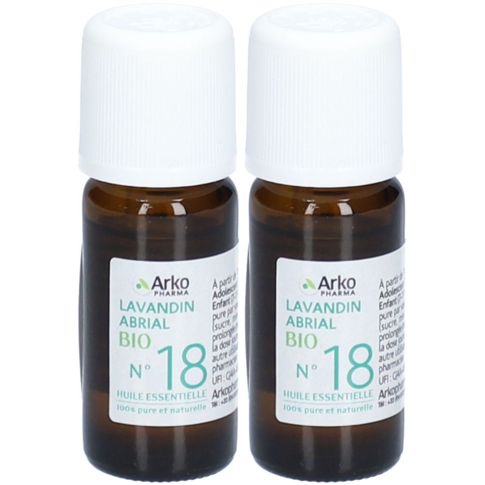Deux flacons en verre brun avec bouchons blancs. Étiquettes avec texte: Lavandin Abrial Bio, N° 18, Huile Essentielle.