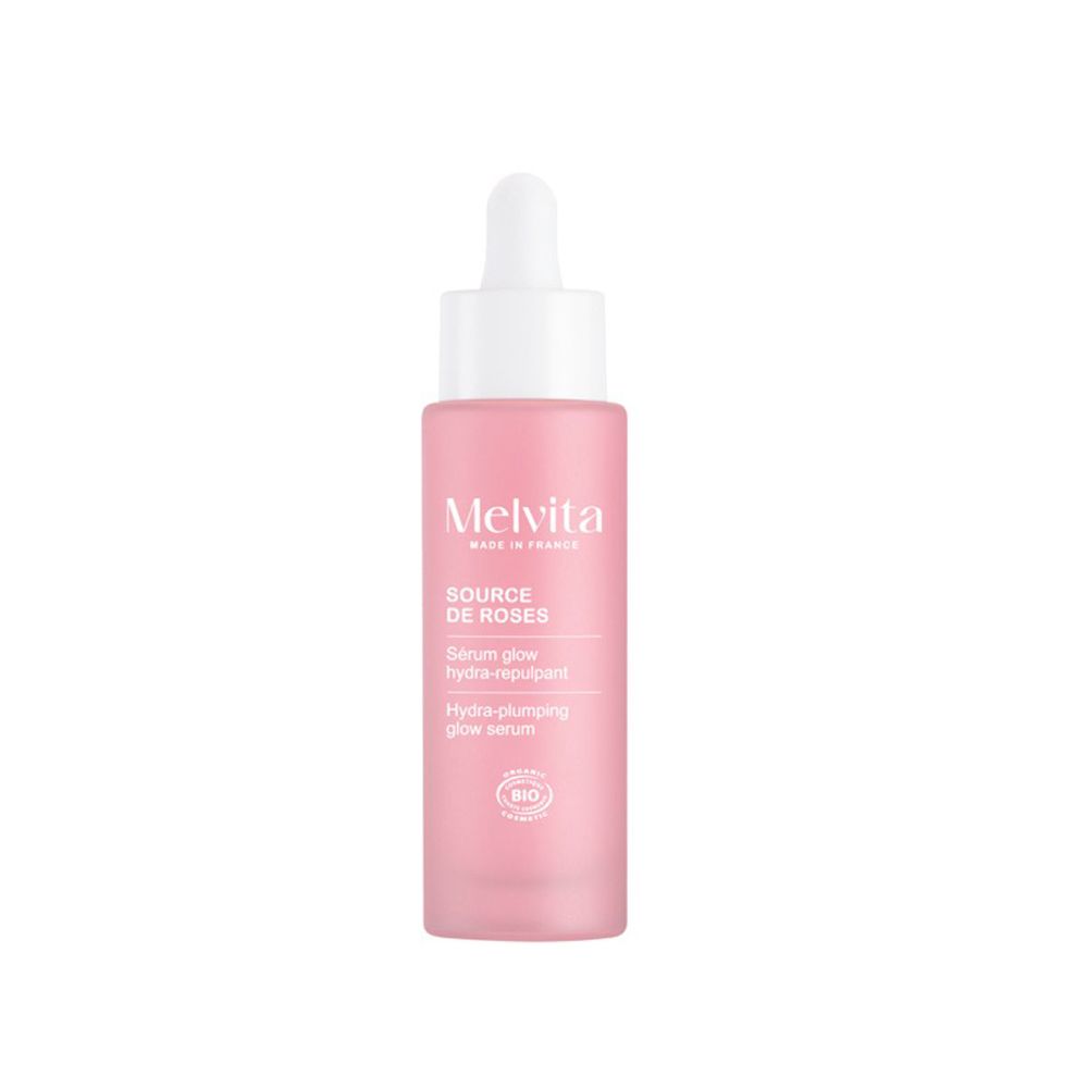 Rosa Flasche mit Pipette. Melvita Source de Roses Serum. BIO-Zertifizierung.