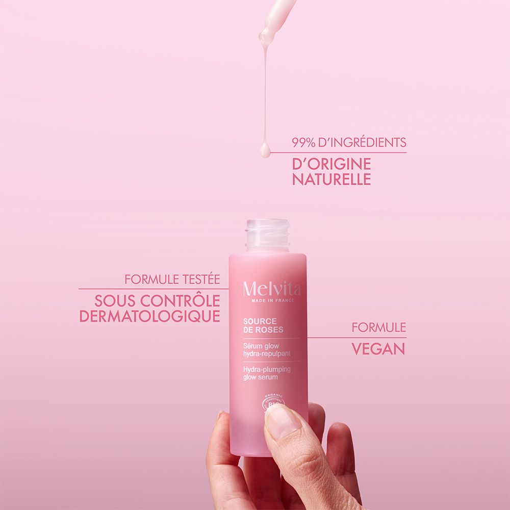 Rosa Flasche mit Pipette. Text: 99% natürlichen Ursprungs. Dermatologisch getestet.