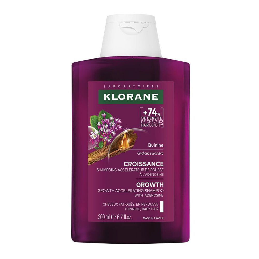 Flasche Klorane Croissance Haarwuchs-Shampoo mit Adenosin. Lila Flasche mit weißem Deckel. Etikett mit Produktnamen und Inhaltsstoffen.