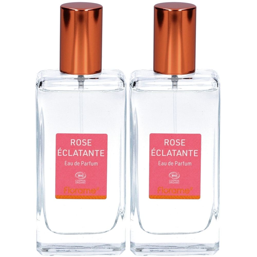 Zwei rechteckige Glasflakons mit kupferfarbenen Deckeln. Rosa Etikett mit Text: ROSE ÉCLATANTE, Eau de Parfum. Bio-Zertifizierung.