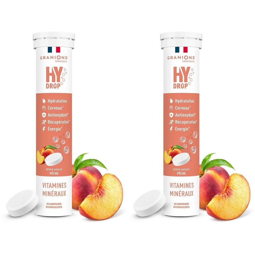 Zwei Tuben mit Tabletten. Aufschrift HY DROP, GRANIONS. Pfirsich und Tabletten daneben. Vitamine und Mineralstoffe.