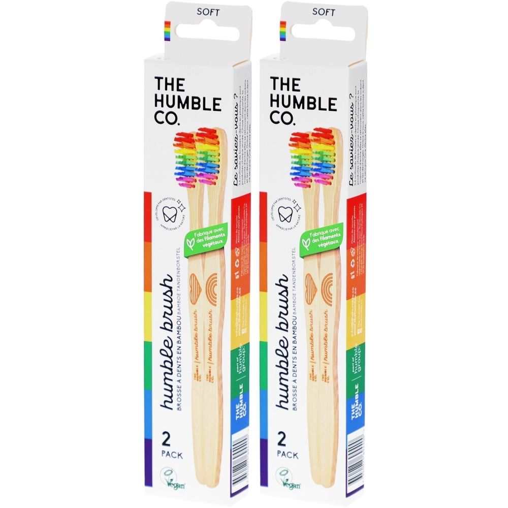 Zwei Zahnbürsten-Verpackungen. Aufschrift: THE HUMBLE CO. Regenbogenfarbene Borsten. Vegan. 2er-Pack.