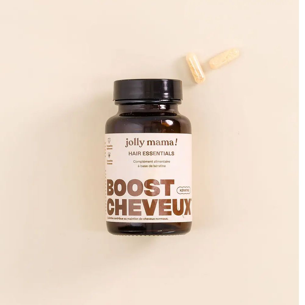 Braune Flasche mit Kapseln daneben. Aufschrift: Jolly Mama! Hair Essentials. BOOST CHEVEUX.