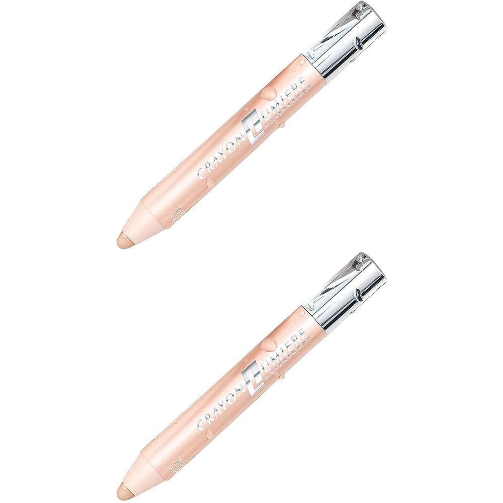 Zwei cremefarbene Kajalstifte mit silbernen Kappen. Aufschrift: Crayon Lumière Finisuede.