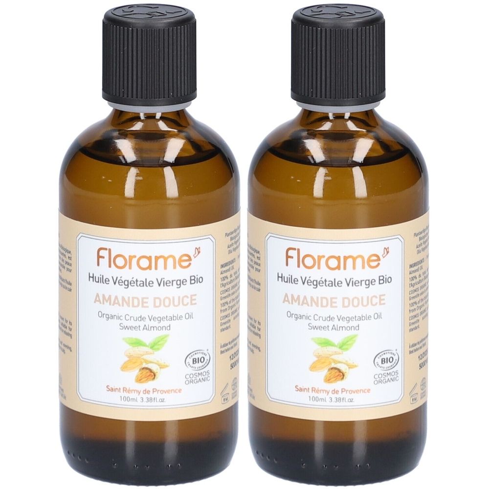 Deux flacons d'huile d'amande douce FLORAME. Flacons en verre brun avec bouchon noir et étiquette. Certification bio.