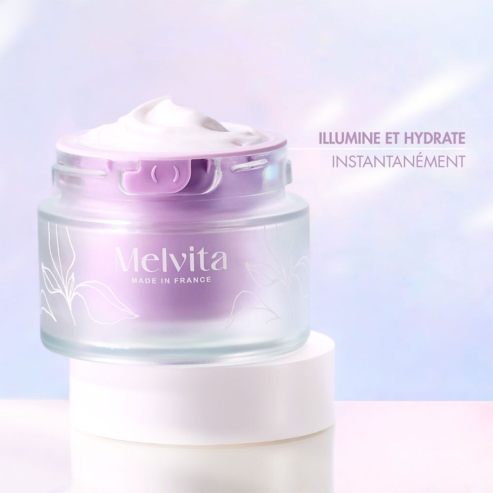 Creme-Tiegel auf einem anderen. Text: Illumine et hydrate instantanément. Melvita.