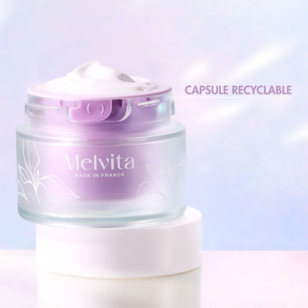 Creme-Tiegel mit Deckel. Text: Capsule recyclable. Melvita.