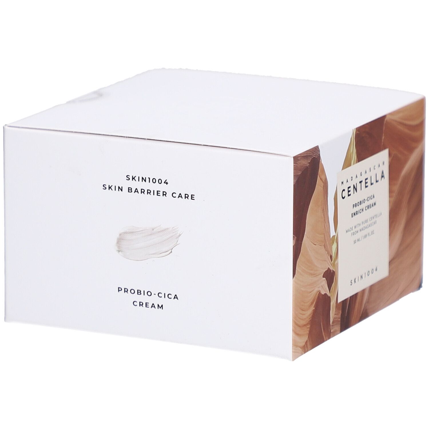 Weiße Produktverpackung. Text: SKIN1004 Skin Barrier Care, Probio-Cica Cream. Hintergrund mit Textur.