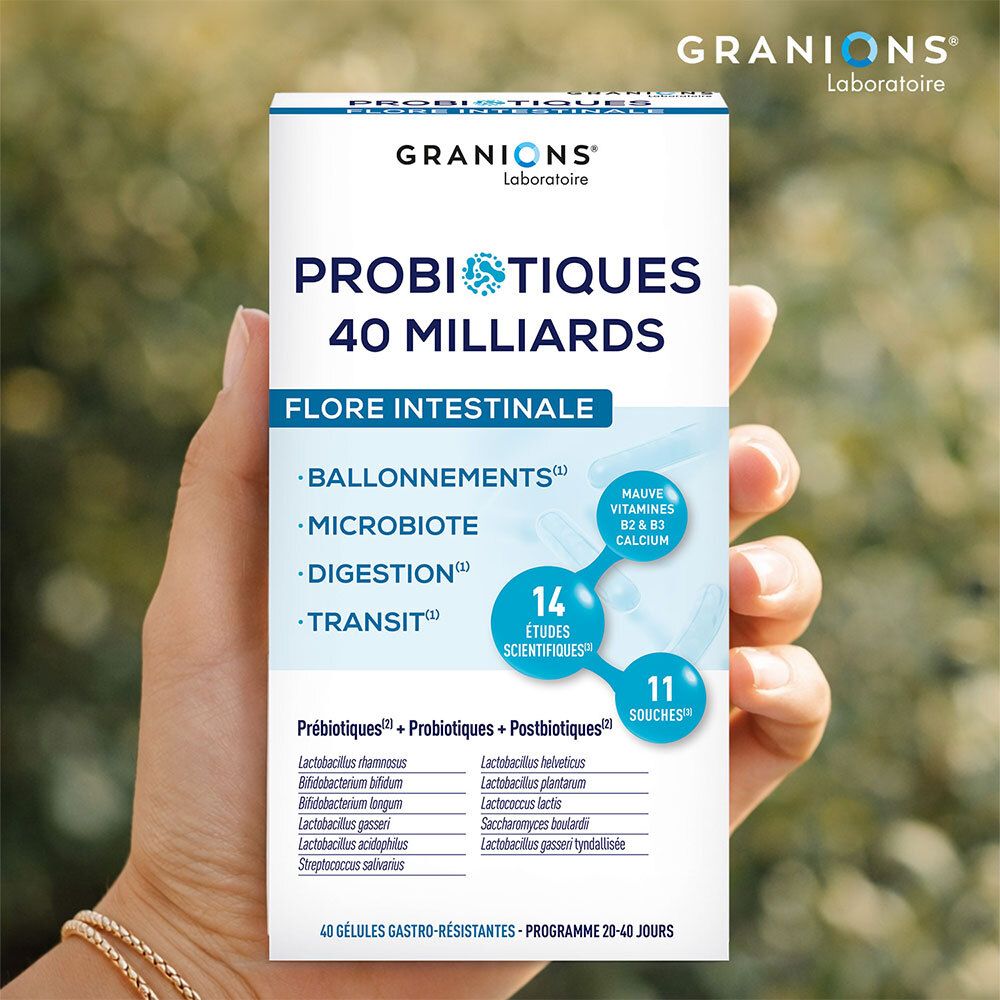 Hand hält Schachtel Granions Probiotika, 40 Milliarden, Darmflora. Enthält 11 Stämme, 14 Studien. Vitamine.