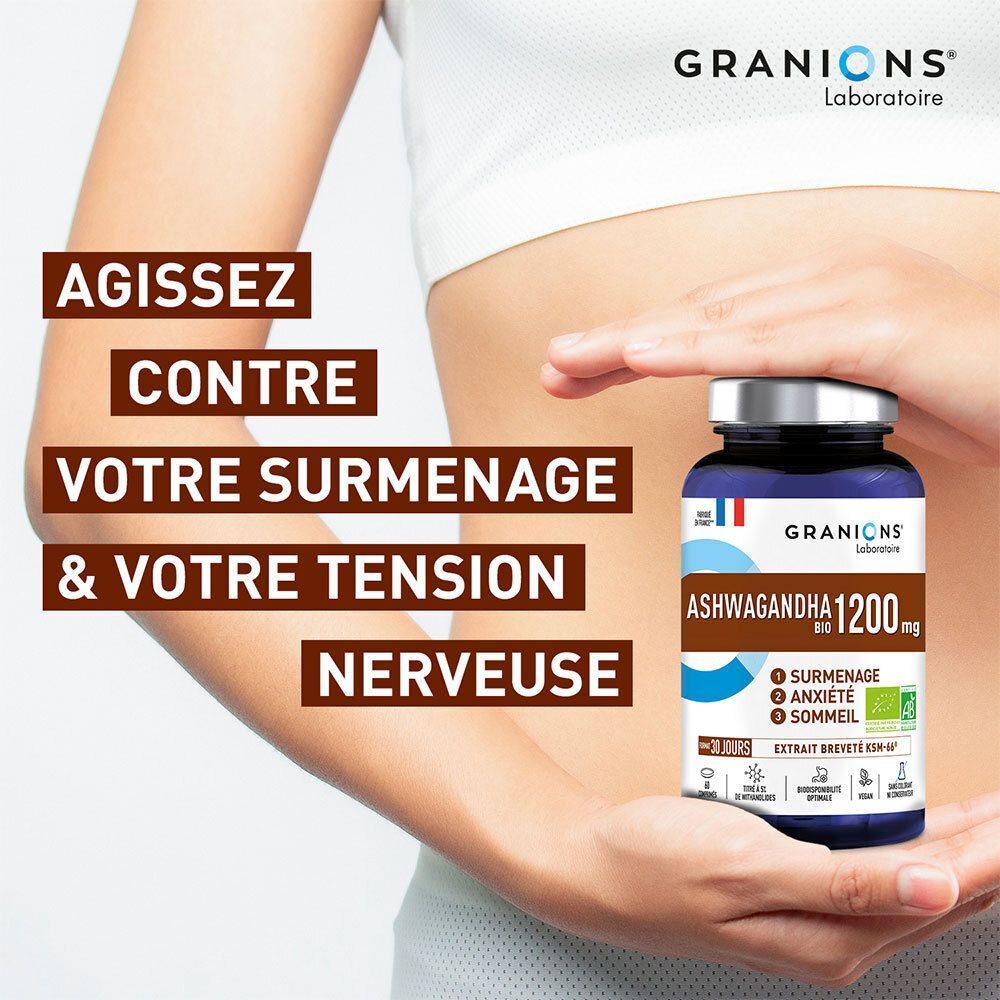 Mains tenant un flacon de GRANIONS Ashwagandha Bio 1200 mg devant un ventre.