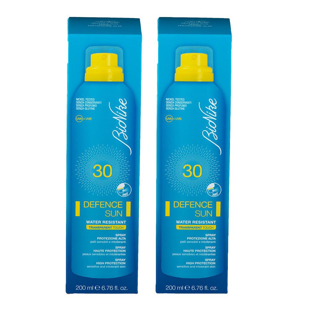 Zwei blaue Sprays mit gelbem Sprühkopf. Aufschrift: BioNike, 30, DEFENCE SUN, Wasserfest. 200 ml.