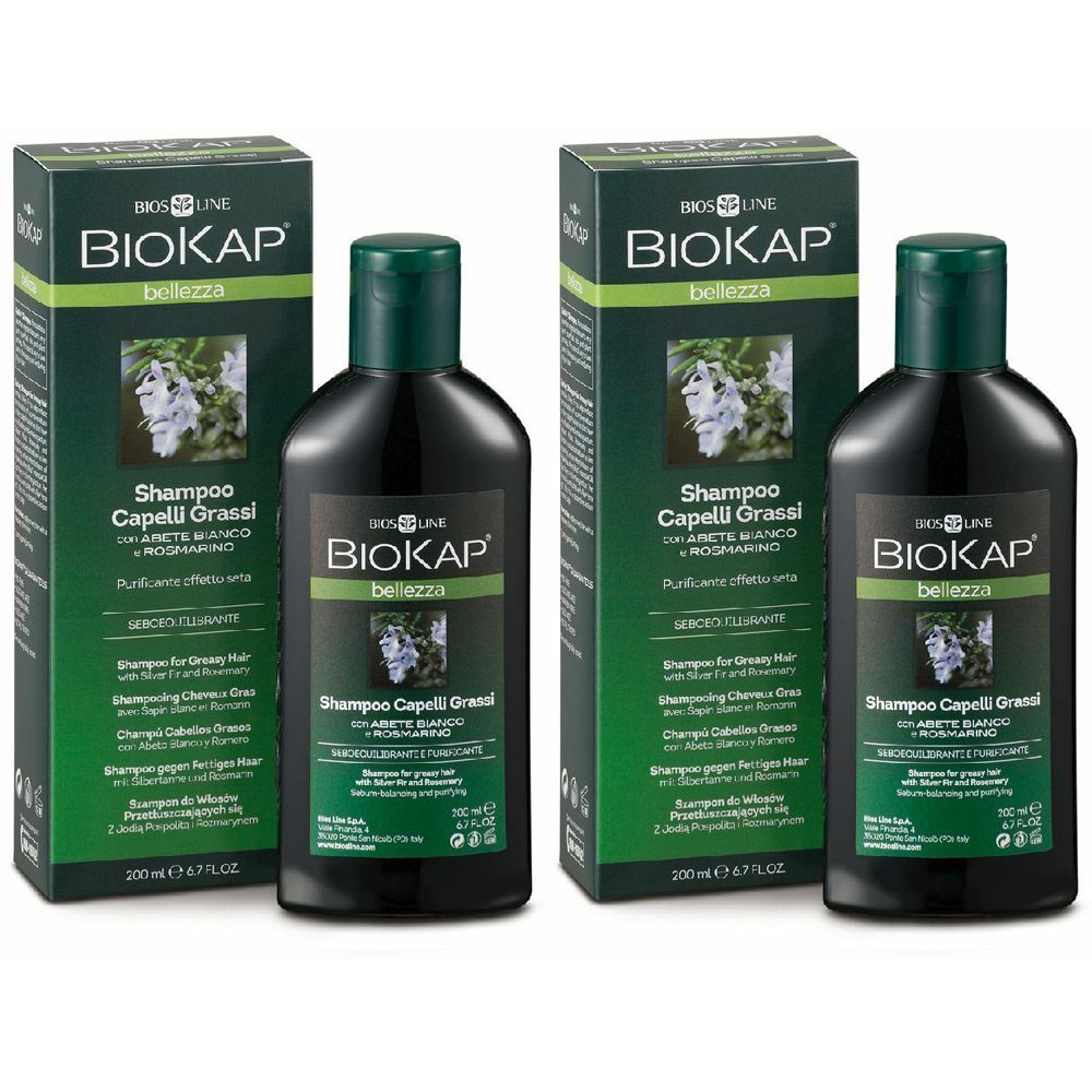 Zwei Flaschen und zwei Schachteln Shampoo. Aufschrift: BIOKAP, Shampoo Capelli Grassi.