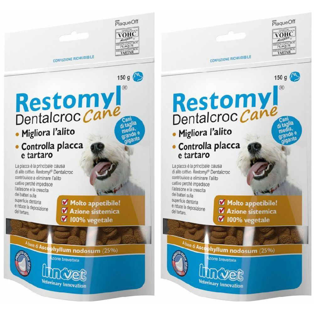 Deux paquets de Restomyl Dentalcroc Cane. Inscriptions : Migliora l'alito, Controlla placca e tartaro. Avec un chien sur l'emballage.