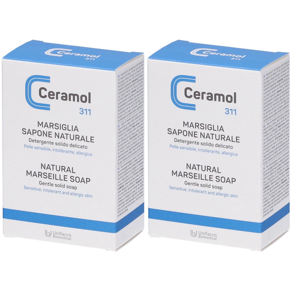 Zwei Kartons Ceramol 311 Marsiglia Sapone Naturale. Weiße Schachteln mit blauem Deckel und Schriftzug. Text: Marsiglia Sapone Naturale, Natural Marseille Soap.