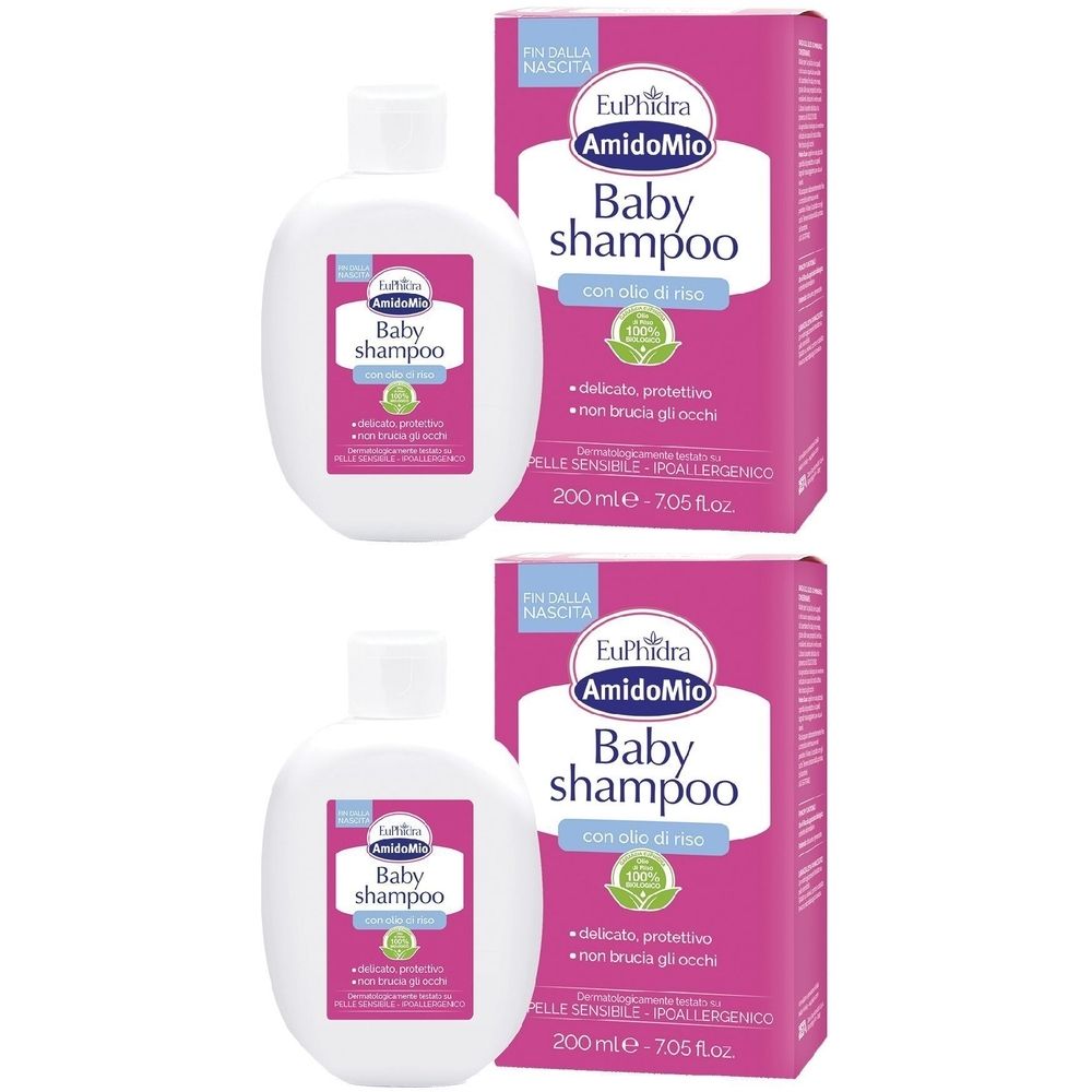 Deux flacons de shampooing pour bébé avec emballage rose. Inscription : EuPhidra Amido Mio Baby Shampoo. À l'huile de riz. Pour peaux sensibles.