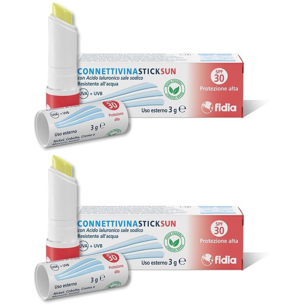 Zwei Lippenpflegestifte mit gelber Spitze und Verpackungen. Aufschrift: CONNETTIVINASTICK SUN, SPF 30, fidia.
