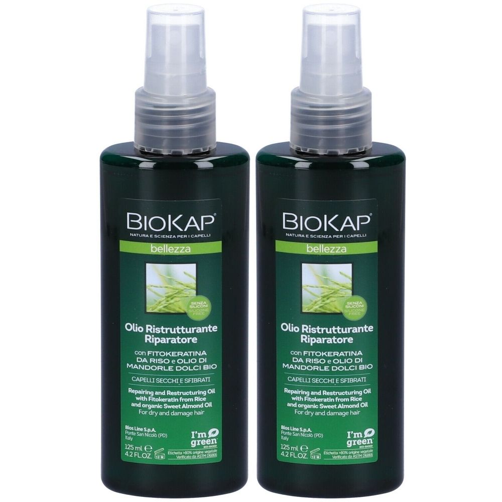 Deux flacons verts avec vaporisateur. Inscription: BIOKAP, Olio Ristrutturante Riparatore. Pour cheveux secs et abîmés.