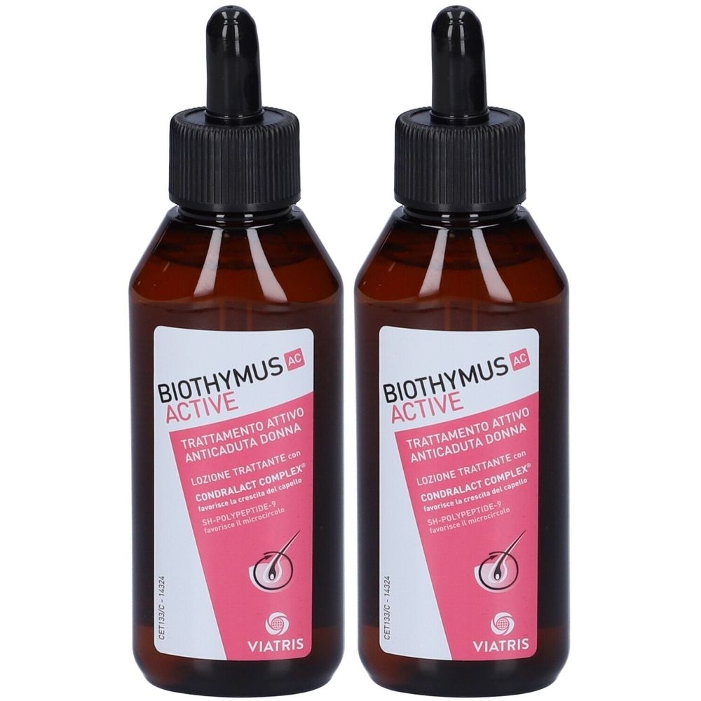 Zwei Flaschen mit brauner Flüssigkeit und schwarzen Pipetten. Auf den Etiketten steht "BIOTHYMUS ACTIVE" und "Trattamento Attivo Anticaduta Donna".