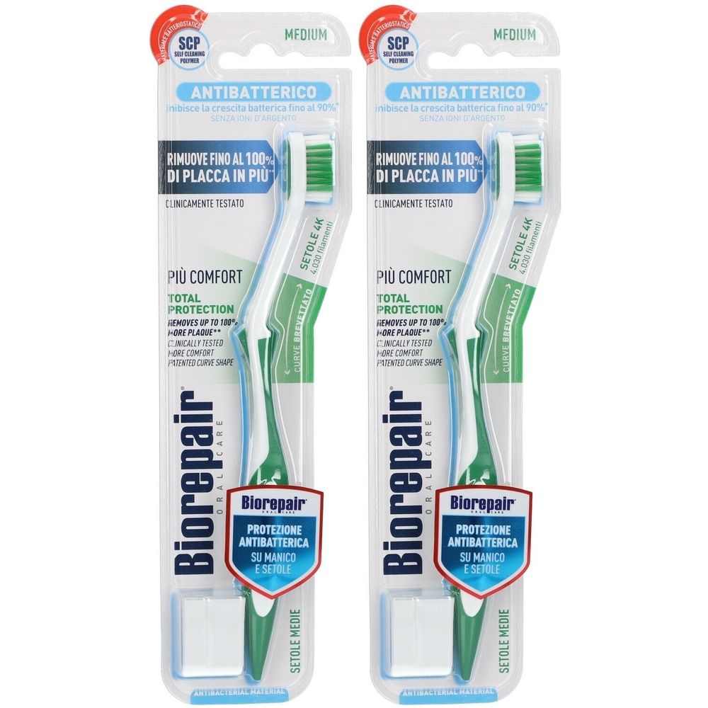 Deux brosses à dents emballées. Soies vertes, manche blanc, détails bleus. Marque Biorepair. Antibactérien, soies moyennes.