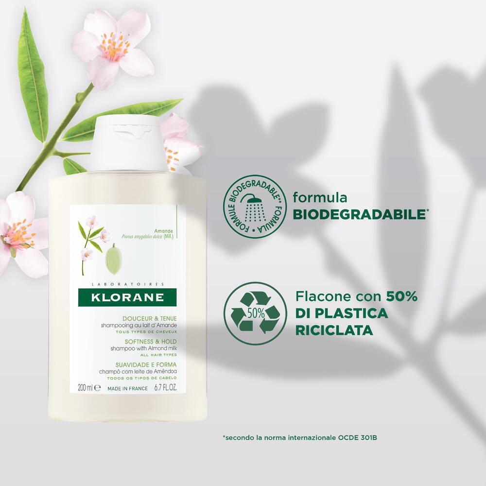 KLORANE Mandelmilch-Shampoo-Flasche mit Illustrationen. 'Biologisch abbaubar' und 'Recycelte Plastik'.