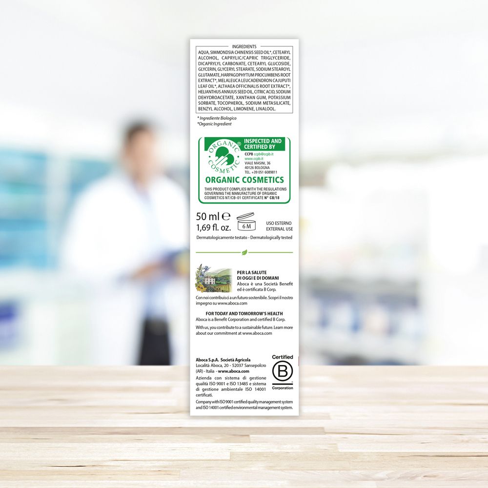 Dos de la boîte avec ingrédients, certifications et logo "Organic Cosmetic". Texte en italien.