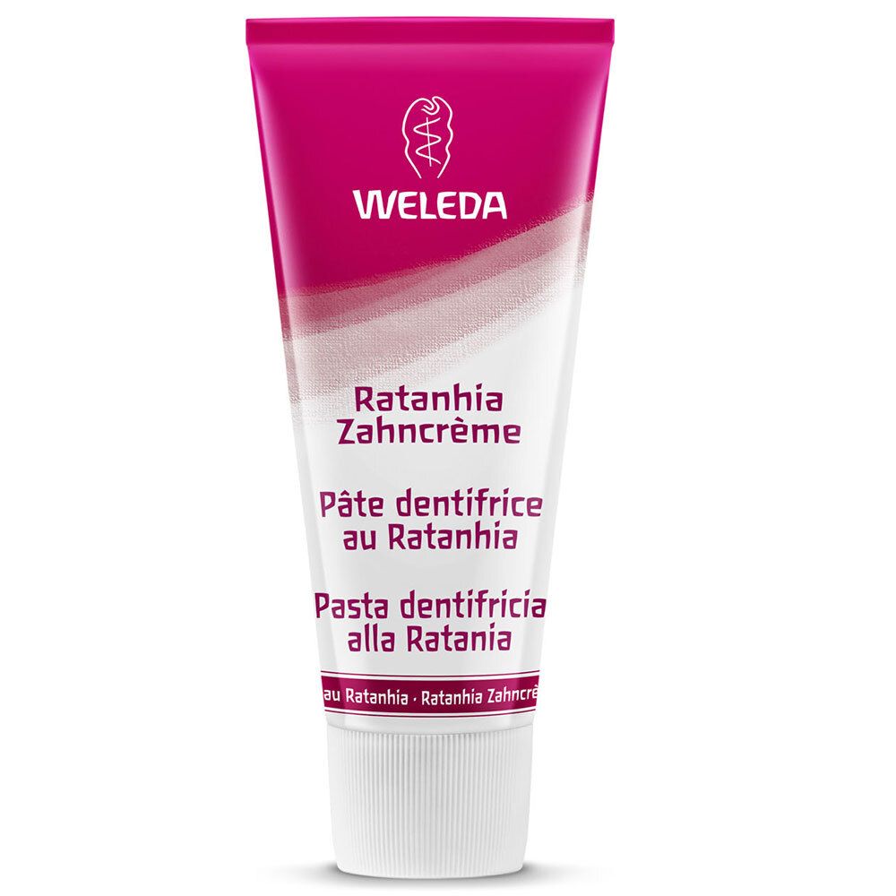 Zahnpasta-Tube, pink-weiß. Beschriftung: WELEDA, Ratanhia Zahncrème, Pâte dentifrice au Ratanhia, Pasta dentifricia alla Ratania.