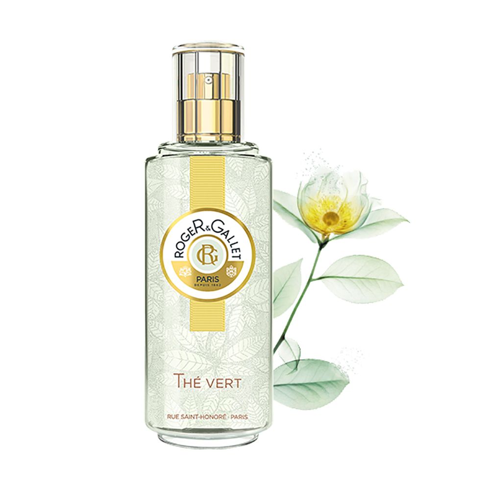 Flacon transparent avec vaporisateur doré. Logo et texte. Parfum Thé Vert. Fleur blanche.