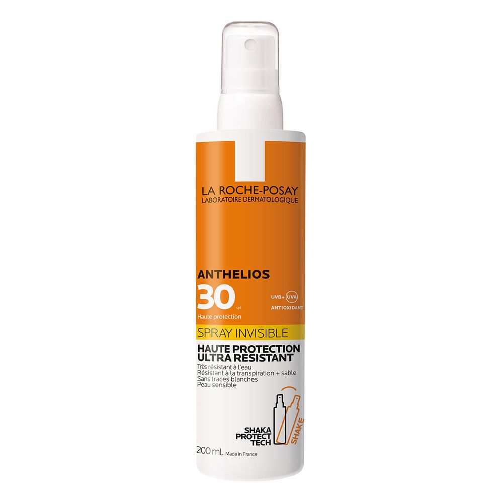 La Roche-Posay Anthelios Spray LSF30. Flacon blanc avec vaporisateur. Étiquettes oranges avec informations produit.