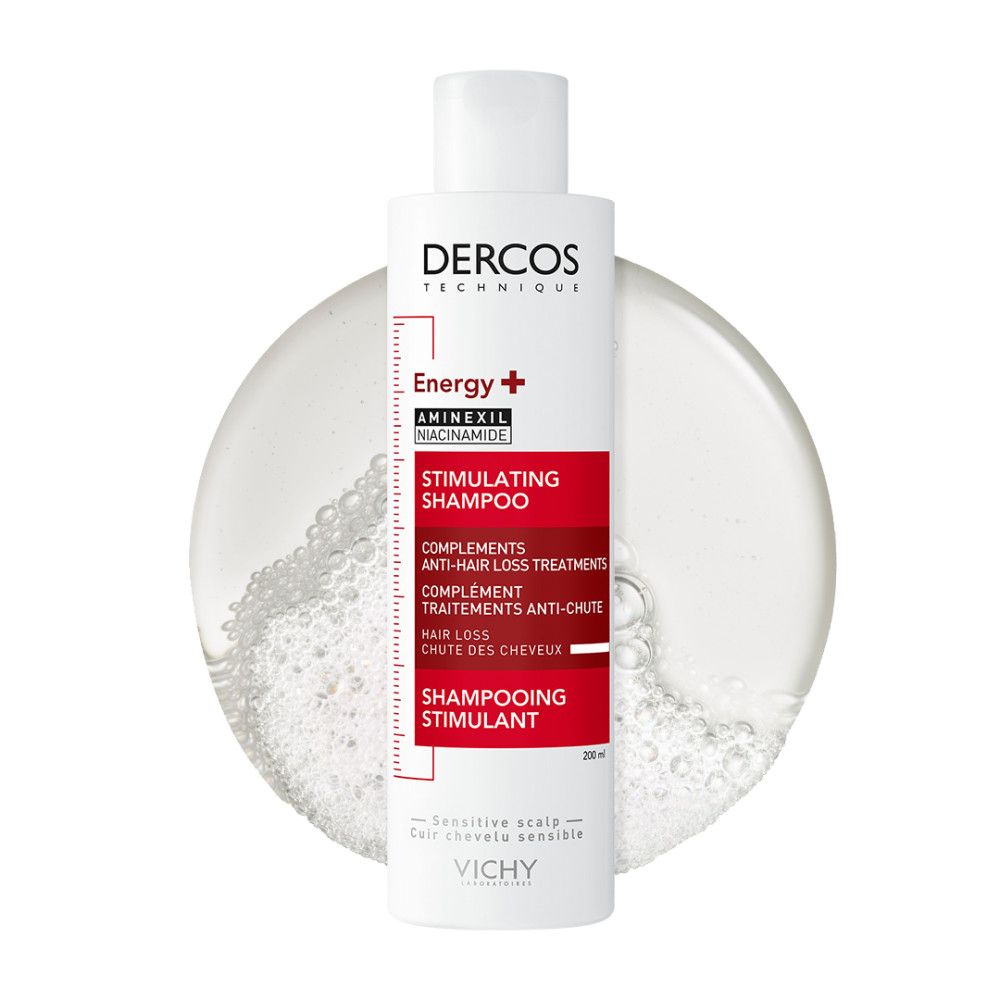 Shampoing Vichy Dercos Energy+ dans un liquide transparent avec des bulles.