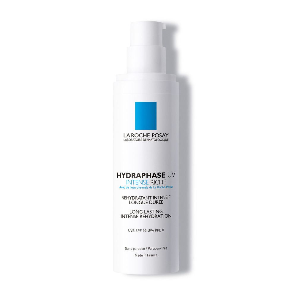 Flacon blanc avec pompe et carré bleu. Inscriptions: HYDRAPHASE UV INTENSE RICHE, SPF 20. Sans paraben.
