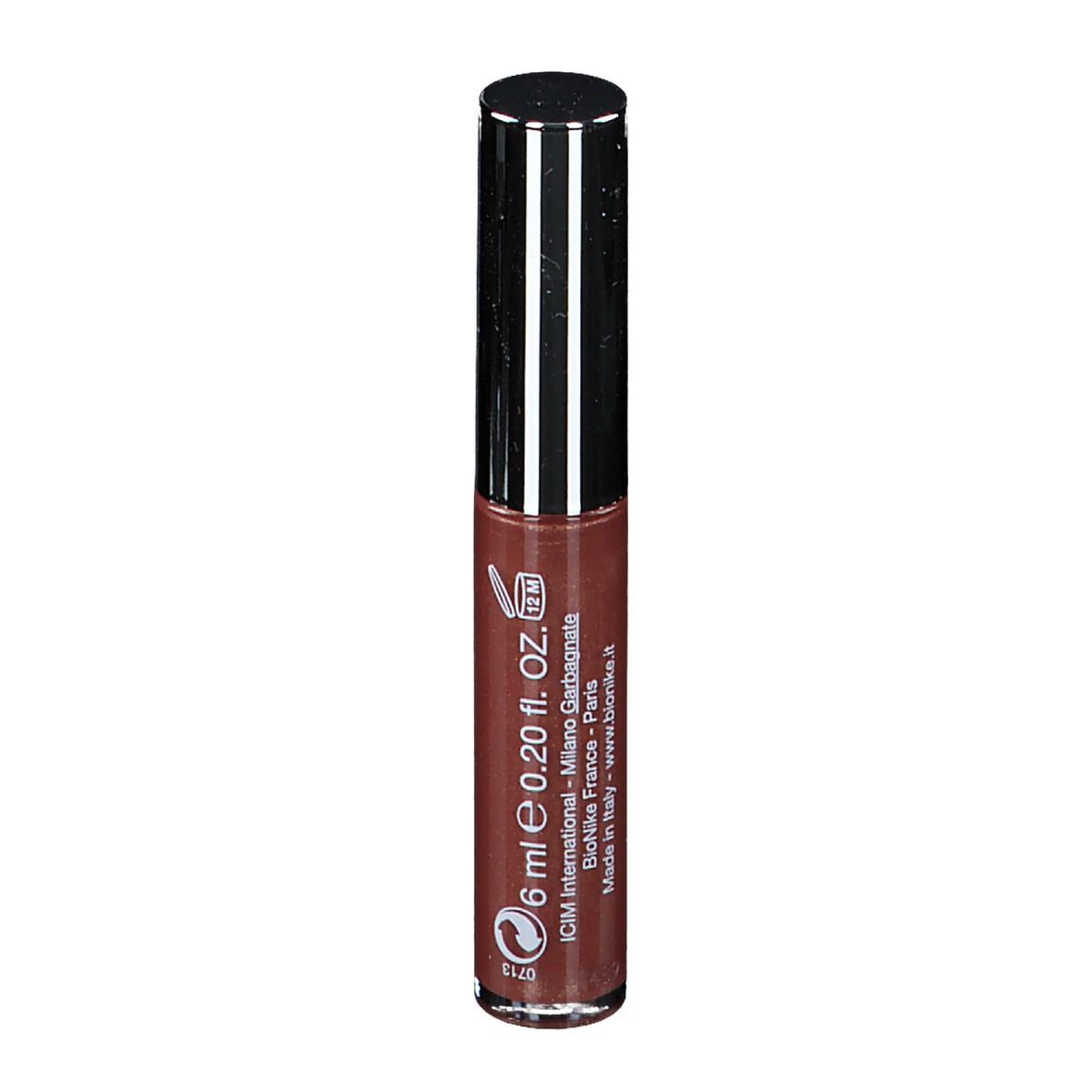 Gloss à lèvres brun avec bouchon argenté. Inscription: DEFENCE COLOR CRYSTAL LIPGLOSS.