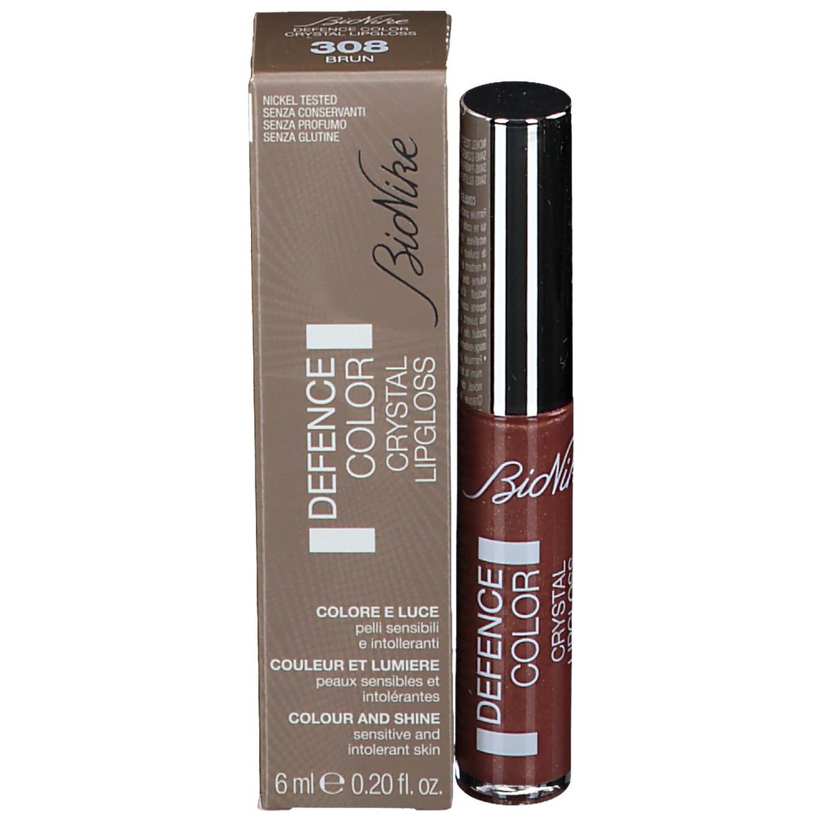 Gloss à lèvres brun et emballage. Inscription: DEFENCE COLOR CRYSTAL LIPGLOSS. Teinte 308 Brun.