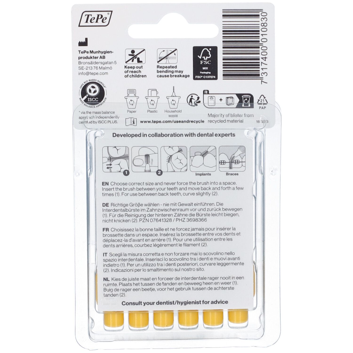 Rückseite der Blisterpackung mit gelben Interdentalbürsten. Produktinformationen, Anweisungen und Recycling-Symbole.