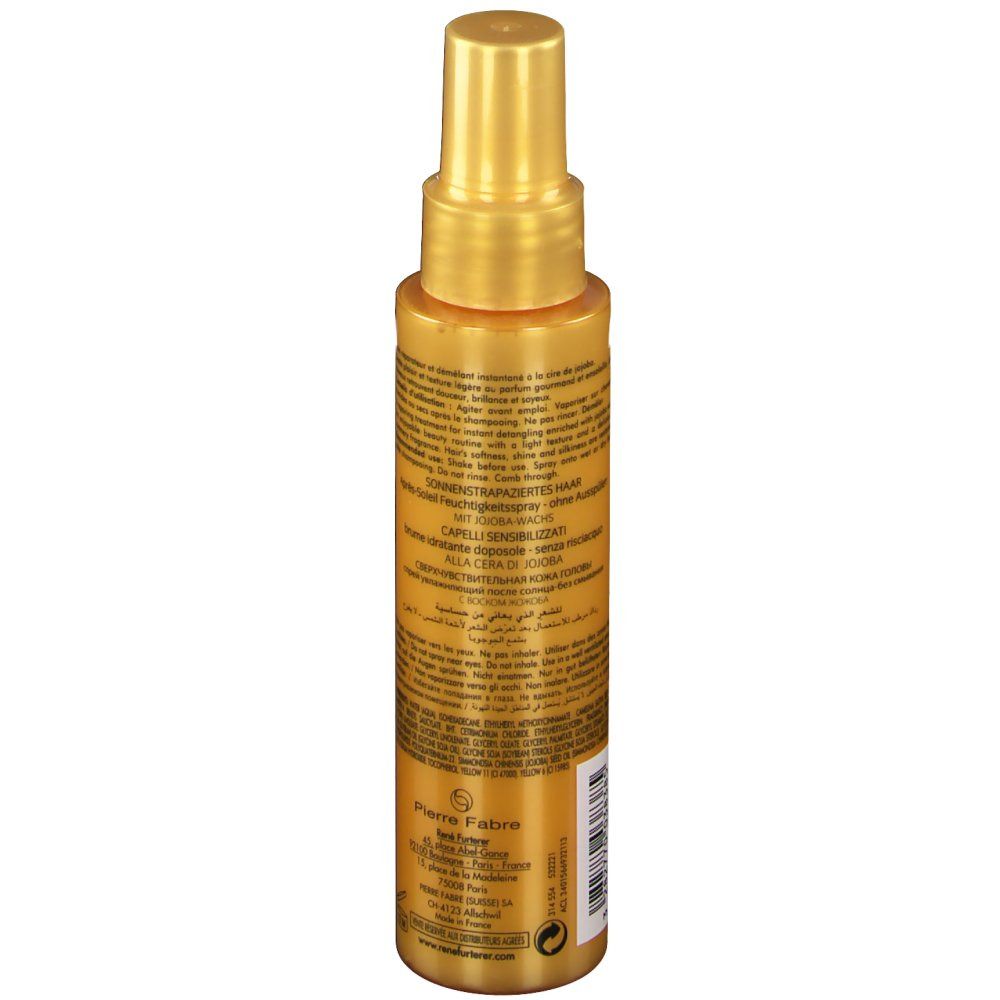 Flacon spray doré, vue latérale avec texte. Contient du texte en plusieurs langues, dont l'allemand.