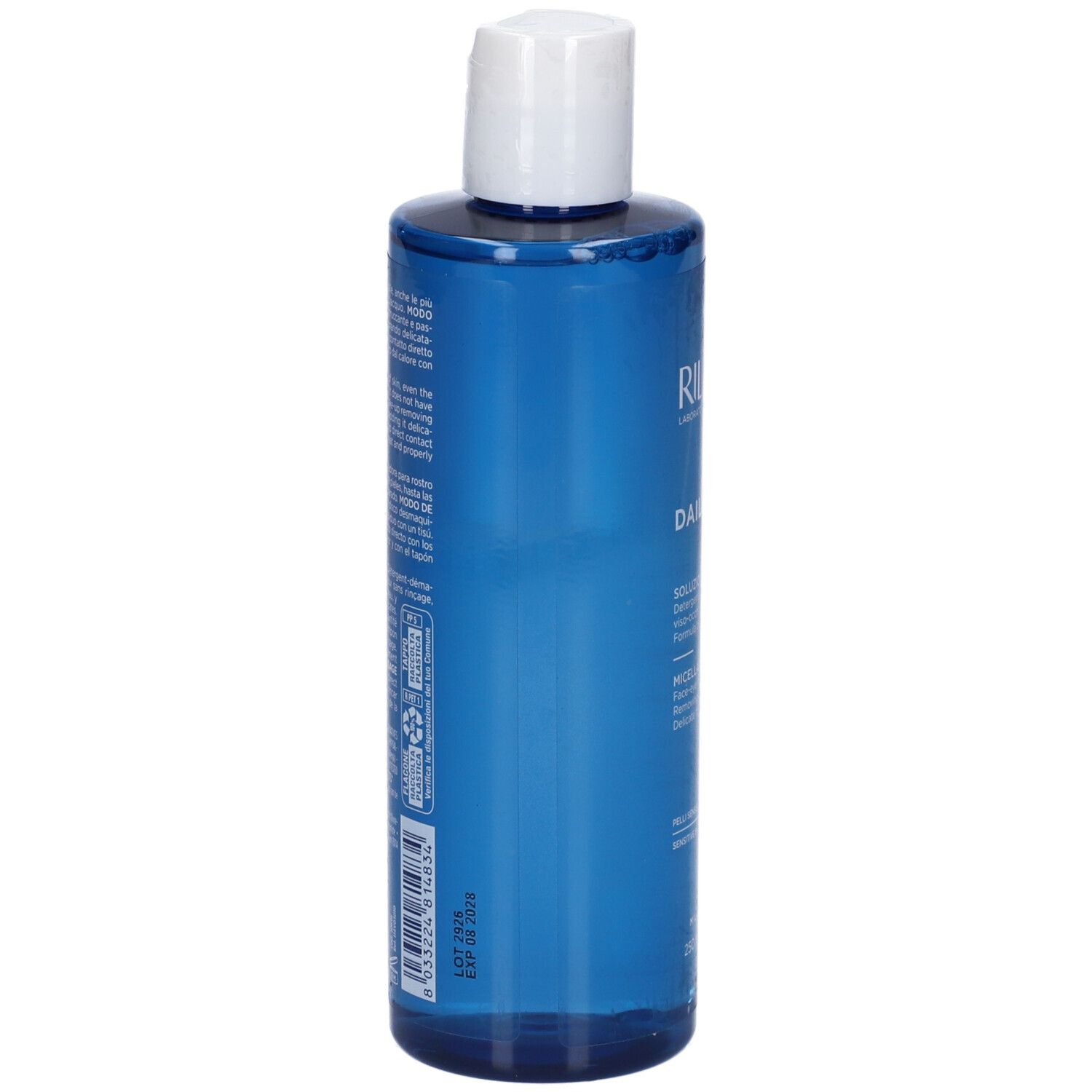 Blaue Flasche mit weißem Deckel. Text auf der Rückseite. Produktinformationen in mehreren Sprachen.