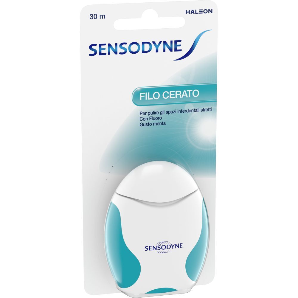 Boîte de fil dentaire. Distributeur blanc et turquoise avec nom du produit et logo de la marque. Inscription : Filo cerato, 30 m.