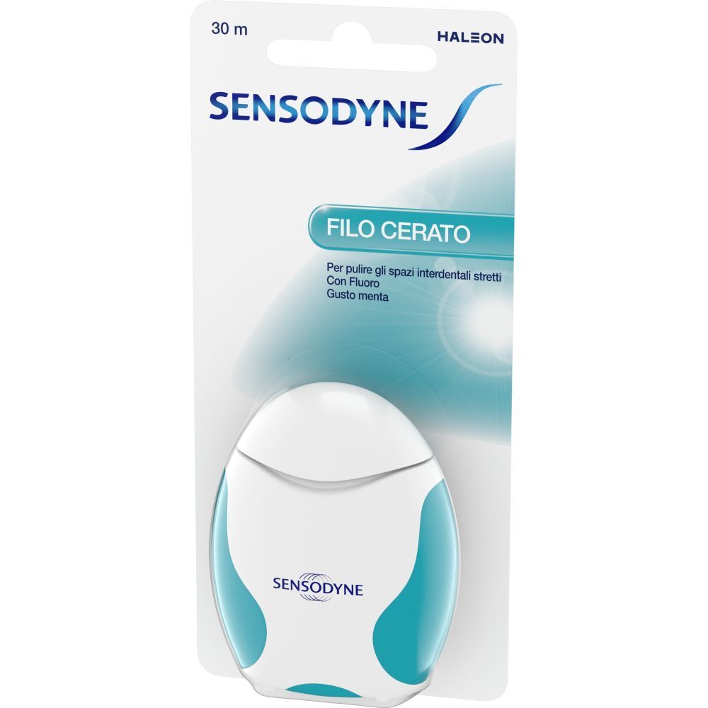 Boîte de fil dentaire. Distributeur blanc et turquoise avec nom du produit et logo de la marque. Inscription : Filo cerato, 30 m.