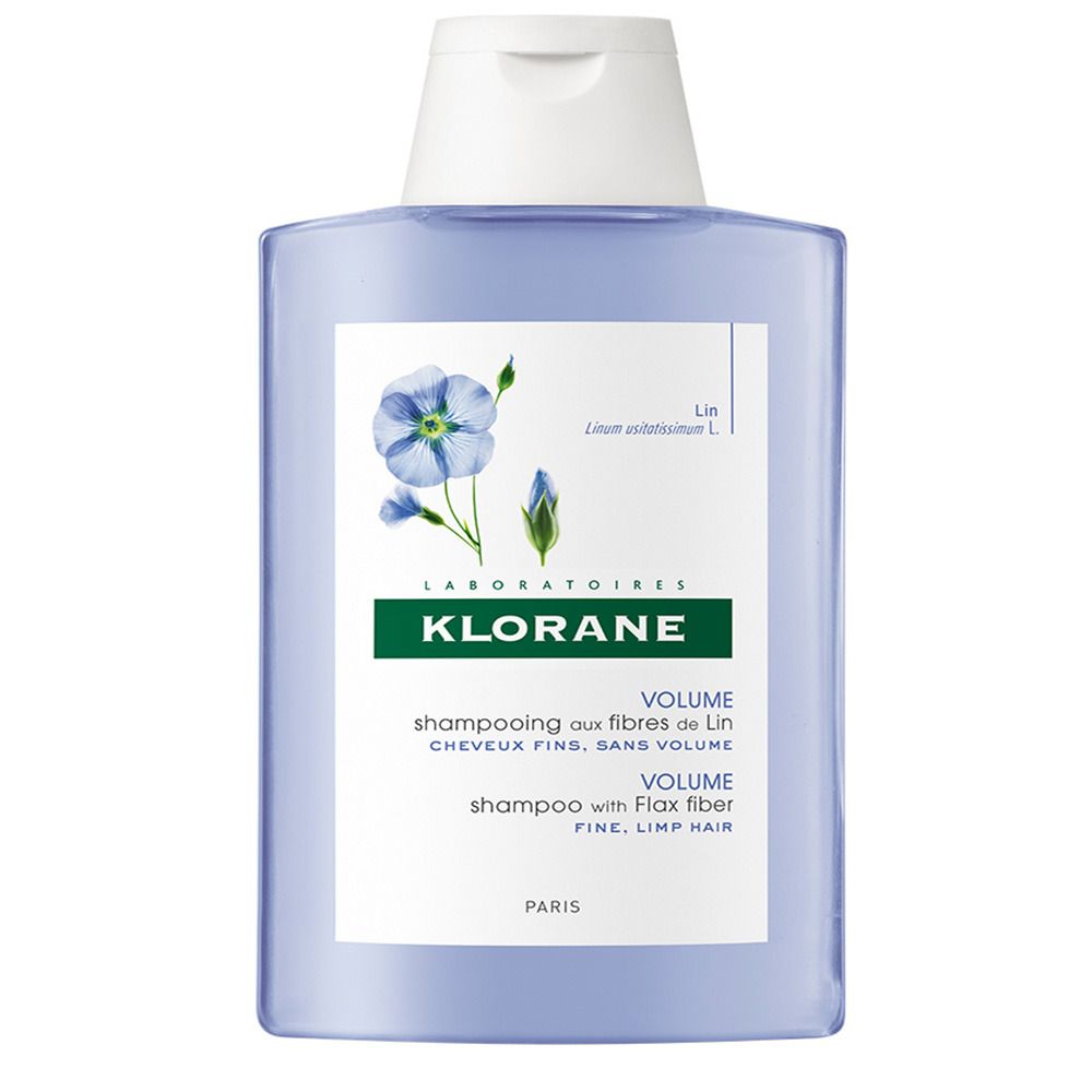 Blau-transparente Shampoo-Flasche. Weißer Deckel. Aufschrift: KLORANE, Volume Shampoo mit Leinfasern. Abbildung einer Blume.