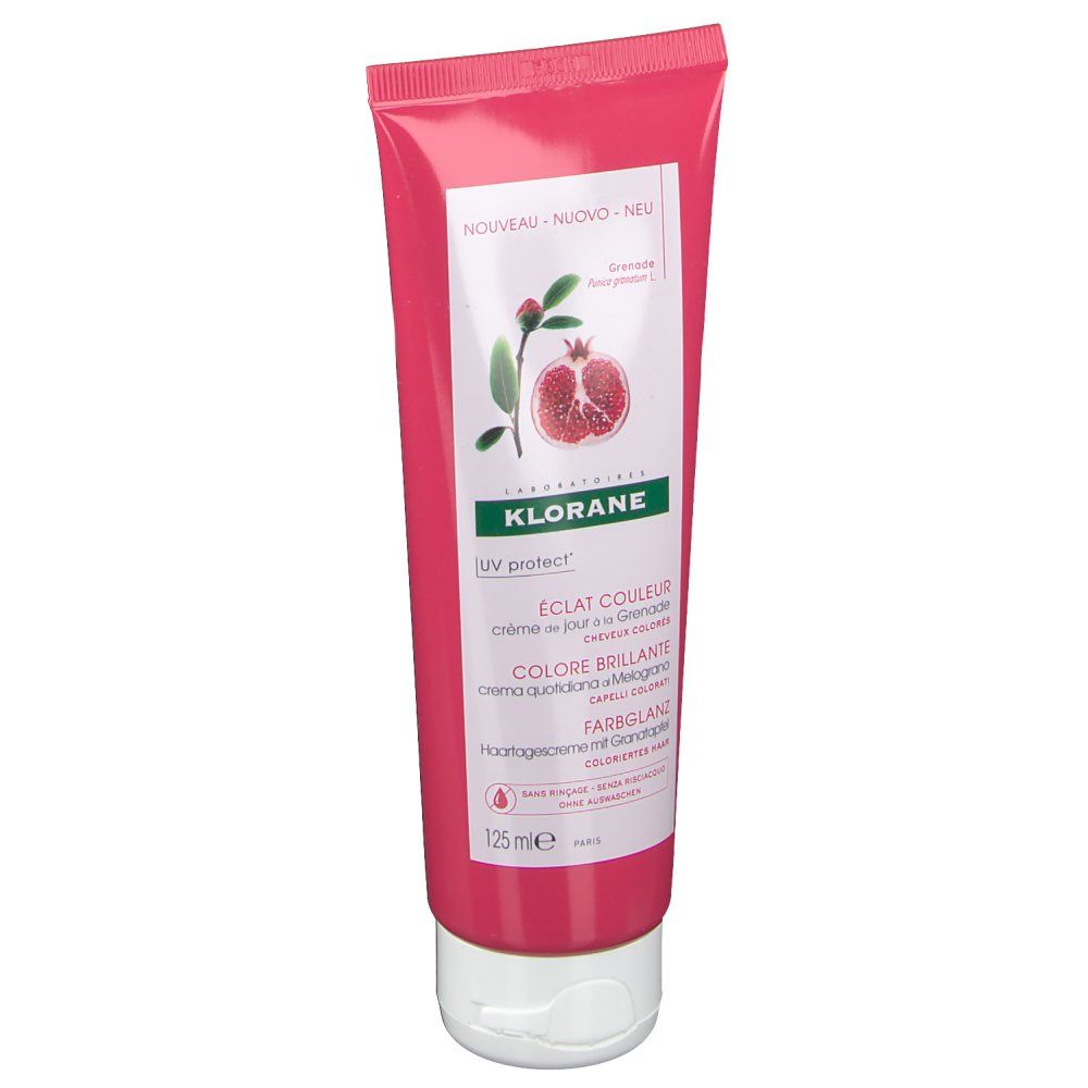 Tube rose avec bouchon blanc. Inscription: KLORANE, crème de jour à la Grenade, UV protect. Illustration d'une grenade.