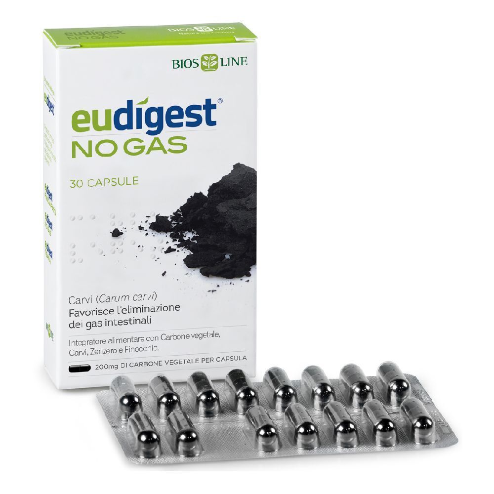 Blisterpackung mit Kapseln und Schachtel mit der Aufschrift Eudigest No-gas. Auf der Schachtel ist ein Haufen schwarzes Pulver abgebildet.